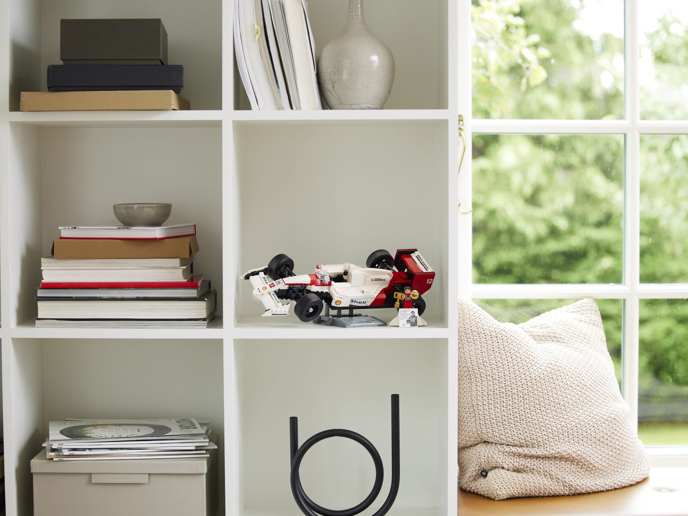 Model displayed on bookshelf
