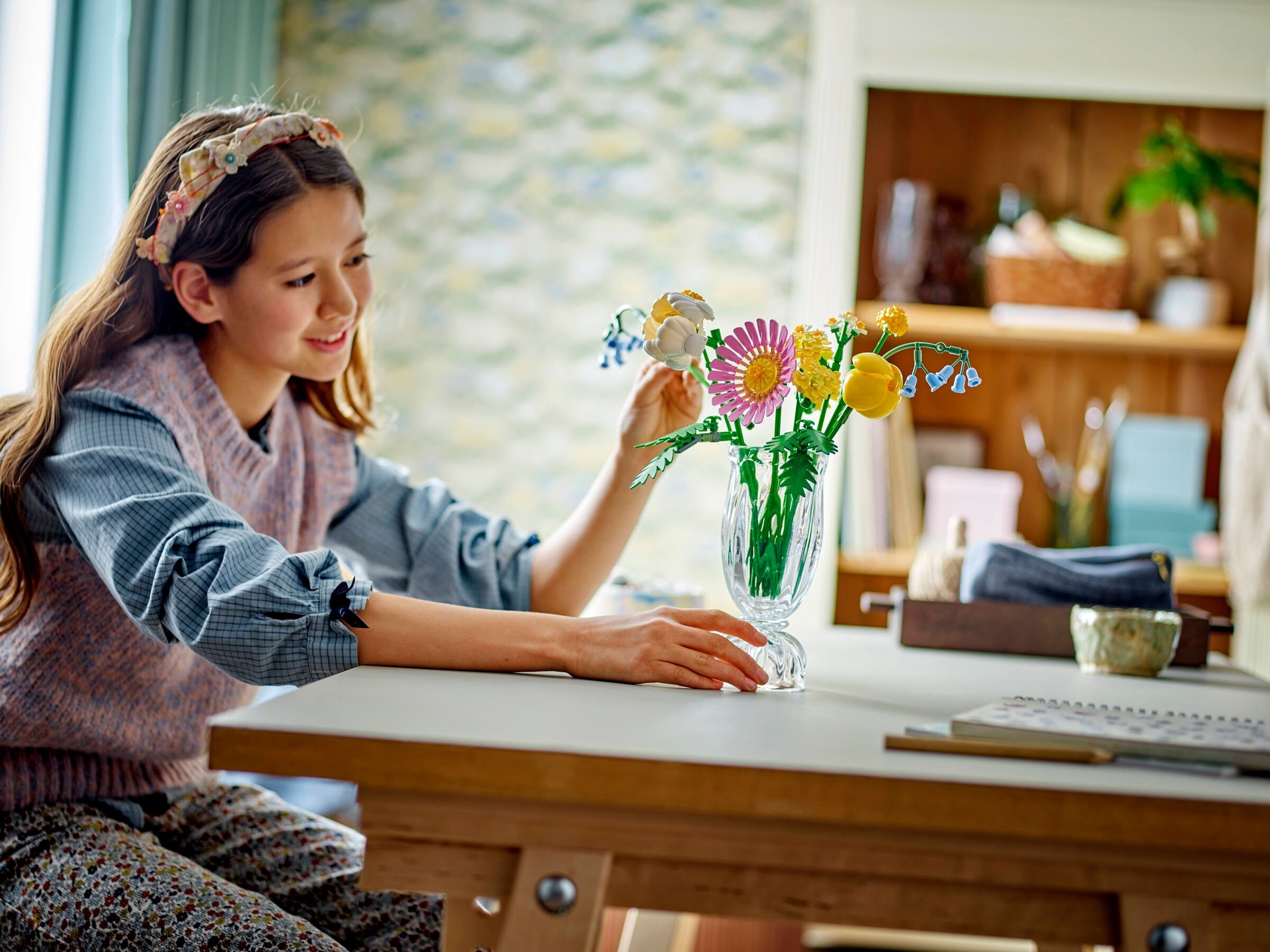 Child arranging completed bouquet