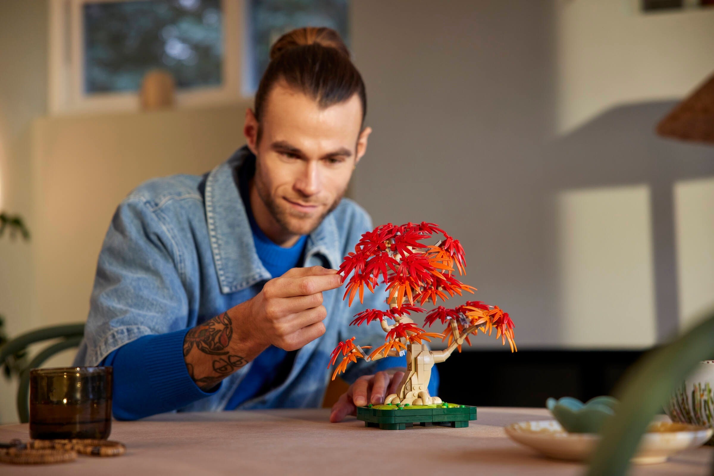Builder adjusting branch positions on completed model