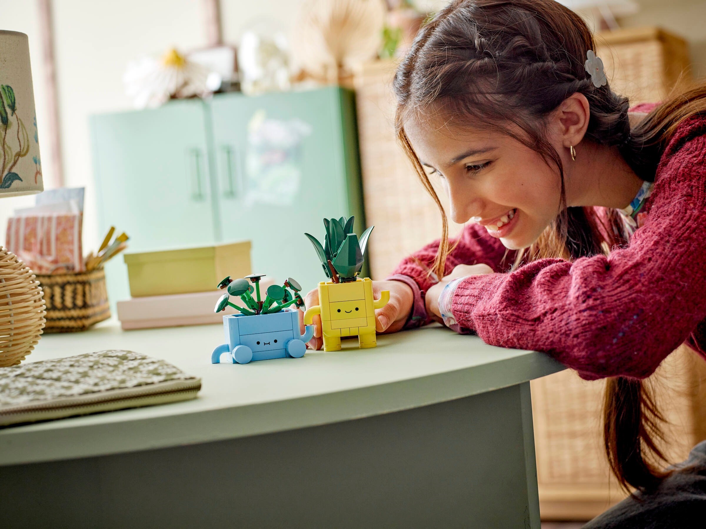 Child playing with completed Happy Plants