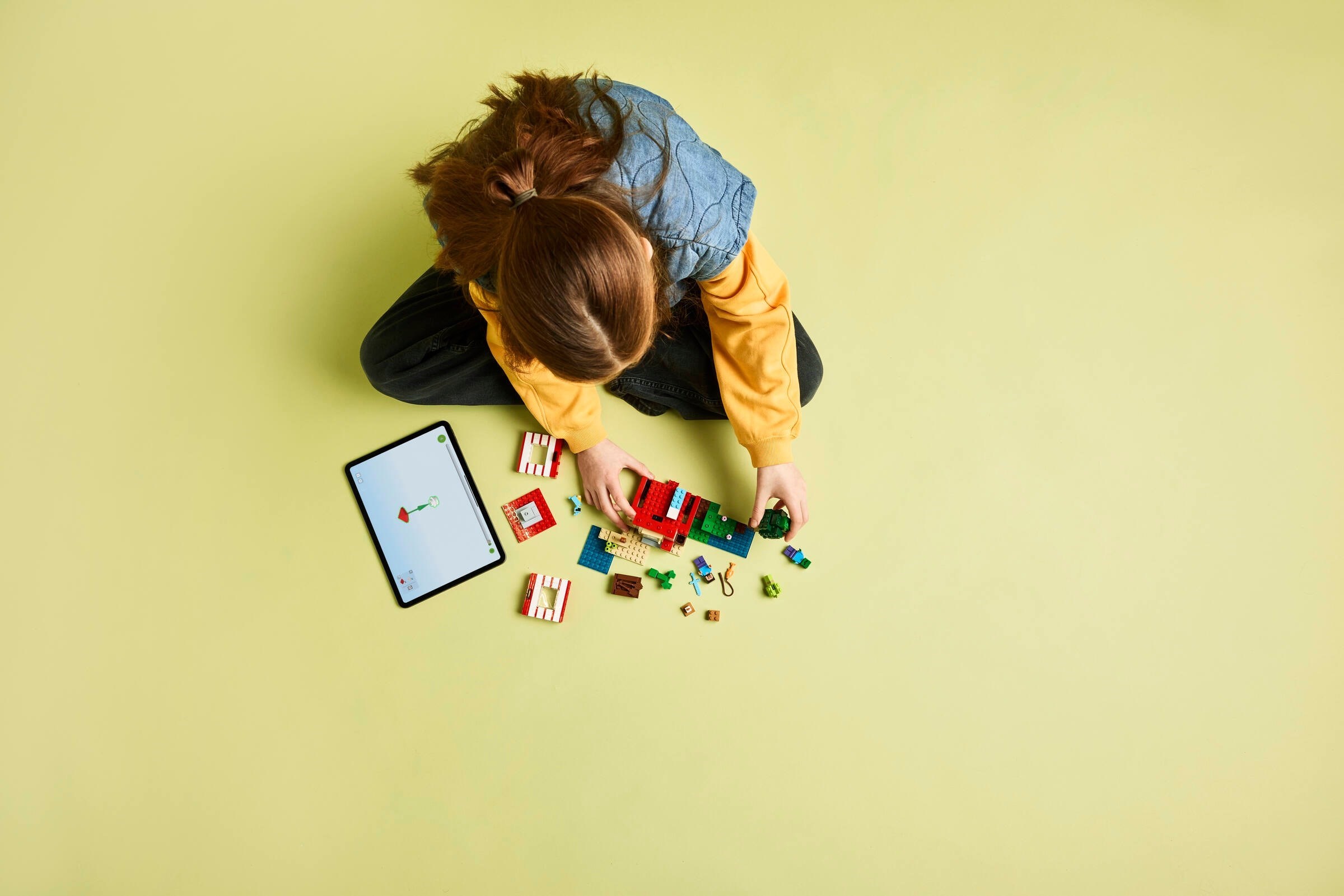 Child playing with TNT Jungle House and tablet integration