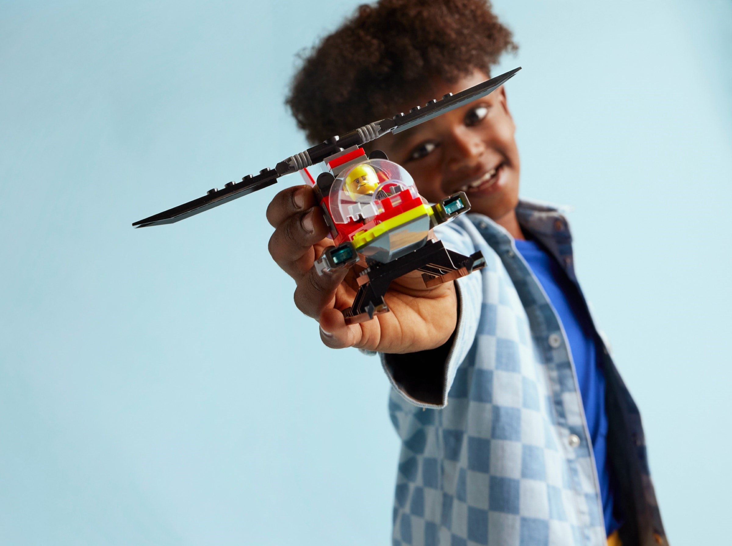 Child playing with completed fire helicopter