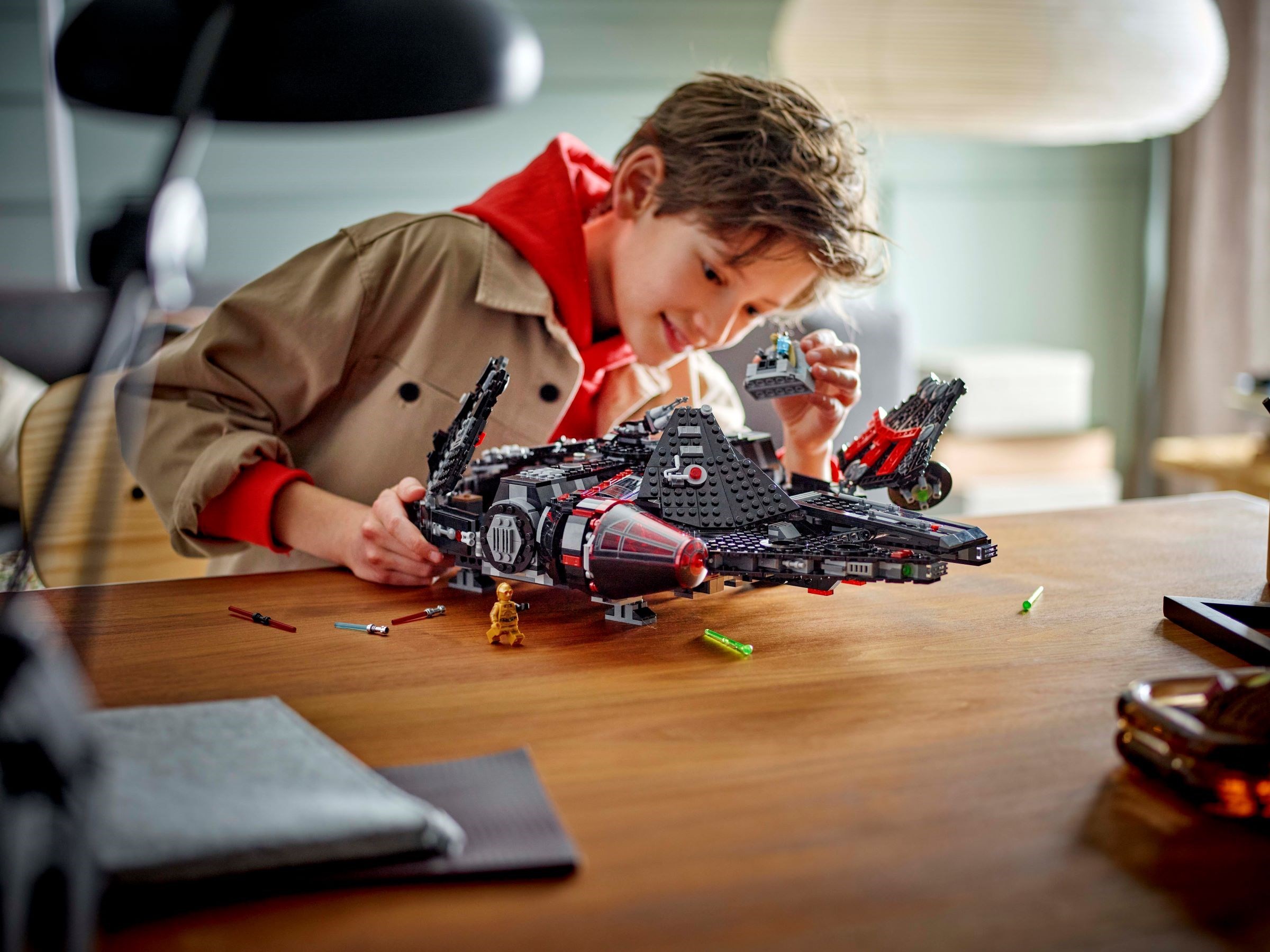 Child playing with Dark Falcon showing scale